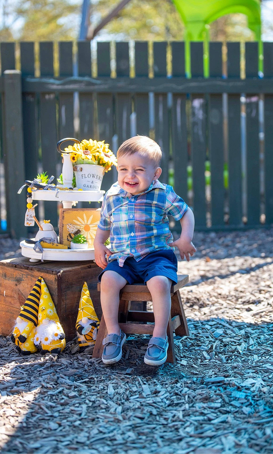 Kylen joined the competition — help win amazing prizes! baby_toddler_clothing, blue, child, electric_blue, fence, grass, happy, joy, leaf, leg, leisure, people_in_nature, person, recreation, shoe, shorts, sitting, smile, sneakers, summer