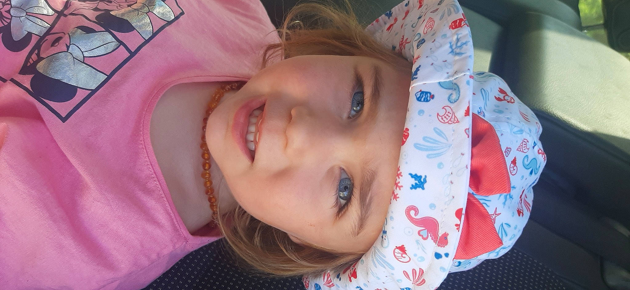 Ghjuliana participe au concours pour gagner de l'argent avec cette photo : baby, cheek, chin, clothing, ear, eyebrow, eyelash, forehead, happy, headgear, headwear, iris, lip, mammal, mouth, neck, nose, person, pink, skin