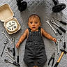 Riyank joined the competition — help win amazing prizes! 6_months, baby, birthday, cake, child, curious, floor_mat, hammer, indoor, infant, laying_down, milestone, overalls, pliers, portrait, screwdrivers, stroller_wheel, tools, wide_eyes, wrenches