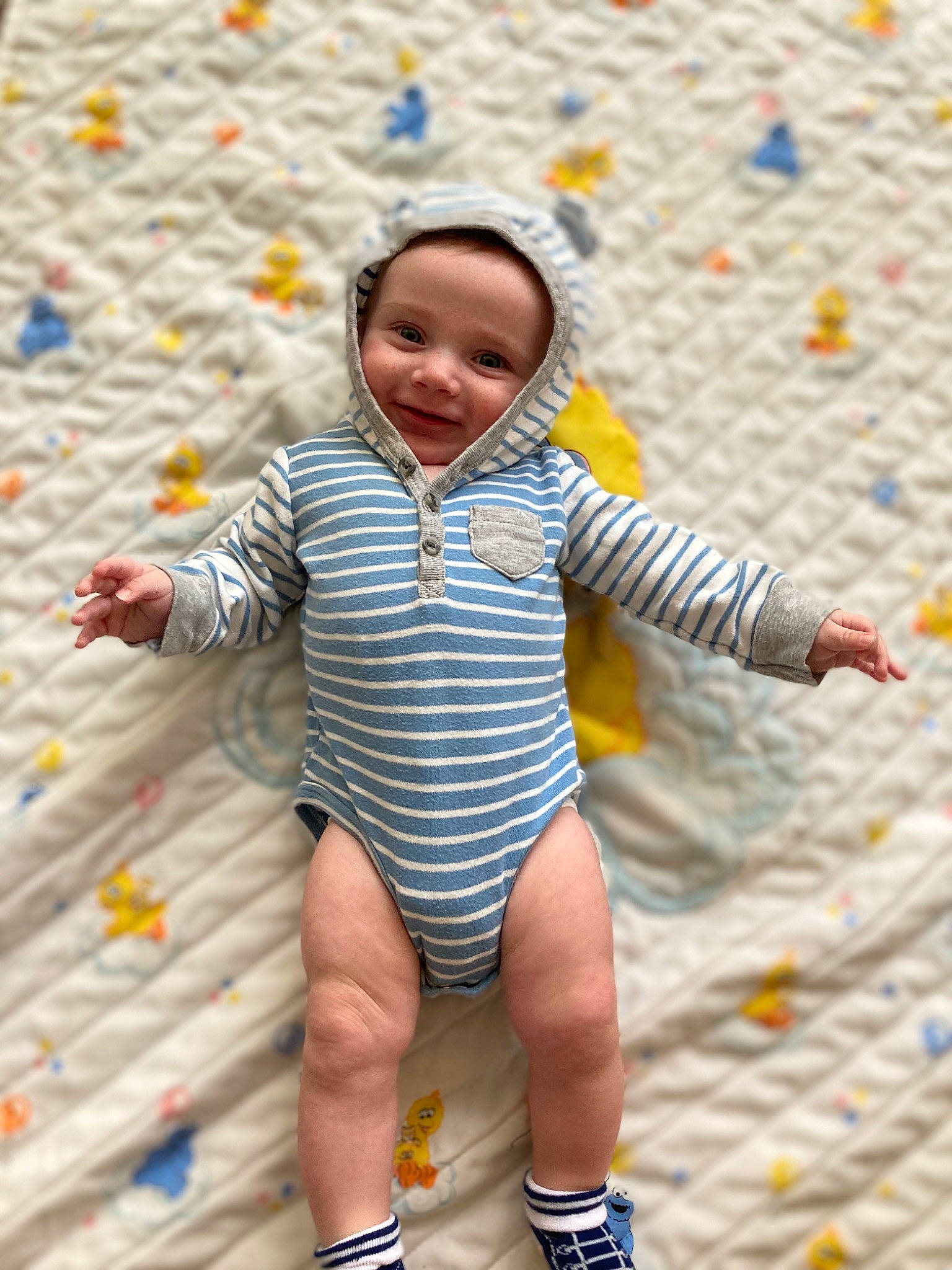 Angelo is registered to the contest to win money with this photo: baby, baby_toddler_clothing, child, face, fun, happy, head, headwear, human, human_leg, joy, leisure, pattern, people_in_nature, person, play, playground, recreation, sand, smile