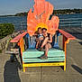 Keifton joined the competition — help win amazing prizes! child, woman, chair, outdoor, lake, water, sky, sunlight, stroller, concrete, trees, smile, casual_clothing, wood, colorful, shadow, daytime, nature, relaxation, people