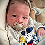 Jules a rejoint le concours — aidez-le/la à gagner de superbes lots ! baby, pacifier, mickey_mouse, infant, clothing, soft_toy, face, portrait, cute, child, indoors, closeup, expression, comfort, cushion, sleepwear, newborn, hand, person, cozy
