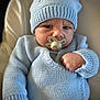 baby, infant, pacifier, knitwear, hat, blue, sweater, face, hand, closeup, portrait, child, cute, indoor, cozy, expression, newborn, person, warm, seated