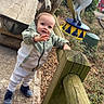 Lyam a rejoint le concours — aidez-le/la à gagner de superbes lots ! toddler, child, outdoor, park, wooden_fence, jacket, curious, sidewalk, carousel, horse_statue, greenery, shoes, casual_clothing, daytime, playground, bench, pathway, nature, young_child, smiling