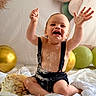 baby, cake, celebration, child, clothing, crumbs, frosting, happy, infant, messy, party, person, playful, sitting, smile, white_cloth, balloons, indoor, cute, fun