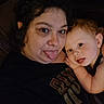 Jameson joined the competition — help win amazing prizes! adult, baby, child, face, tongue_out, smile, curly_hair, person, indoor, cozy, candid, closeup, expression, black_shirt, skin, head, arm, portrait, funny, family