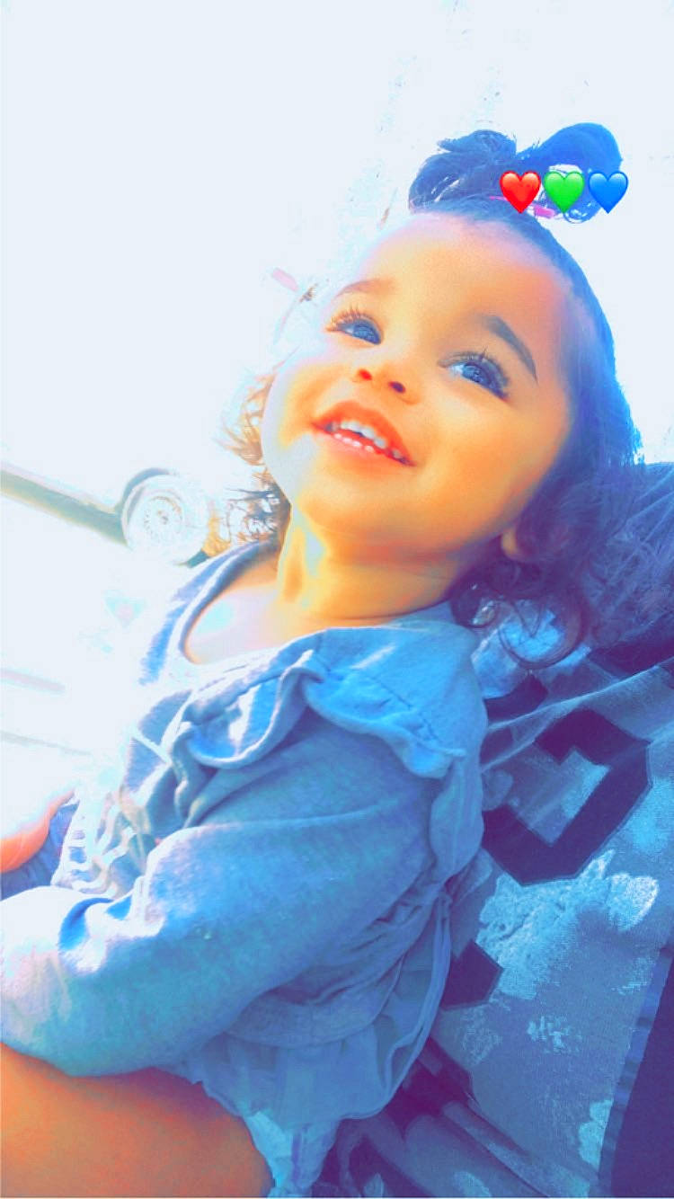 Novah is registered to the contest to win money with this photo: baby, baby_toddler_clothing, child, dress, electric_blue, event, eye, fashion_accessory, fun, happy, hat, head, headband, headgear, headpiece, headwear, iris, lip, party_supply, person