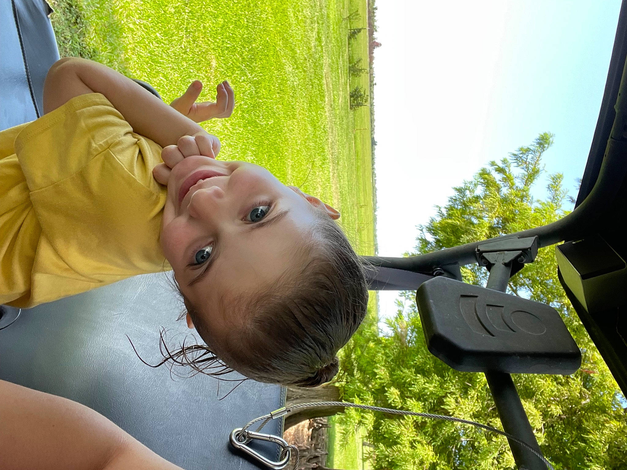 Juniper joined the competition — help win amazing prizes! automotive_mirror, baby, child, fun, gesture, grass, happy, joy, leaf, leisure, outdoor_play_equipment, person, plant, recreation, shade, sky, sunlight, swing, toddler, tree