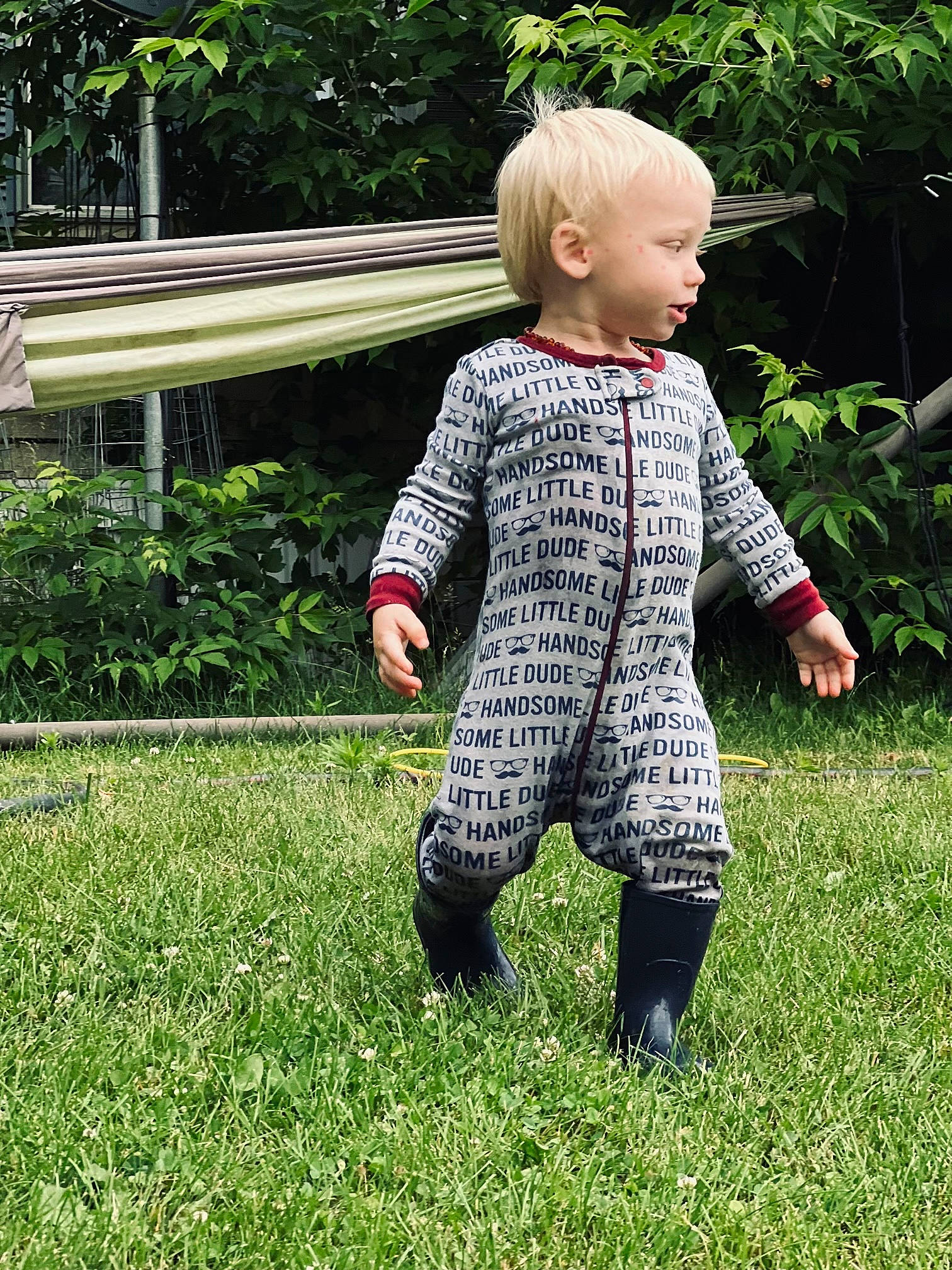 Anderson is registered to the contest to win money with this photo: baby, baby_toddler_clothing, child, fun, garden, gesture, grass, grassland, groundcover, happy, lawn, leg, leisure, pattern, people_in_nature, person, plant, sitting, sleeve, toddler