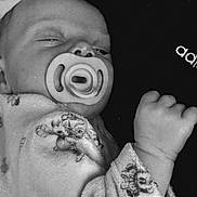 Ambre participe au concours pour gagner de l'argent avec cette photo : baby, pacifier, blanket, sleeping, infant, soft, teddy_bear_print, hand, cozy, resting, black_and_white, portrait, child, cute, young, indoors, comfort, peaceful, face, clothing