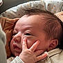 baby, newborn, infant, face, hand, fingers, eyes, hair, cheek, mouth, blanket, onesie, closeup, portrait, sleepy, cozy, skin, nails, car_seat, soft_pillow