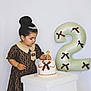 toddler, child, birthday, cake, candle, balloon, number_two, dress, tiara, party, celebration, indoor, white_background, table, decorations, cute, young_child, fashion, girl, event