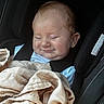 Waylon is registered to the contest to win money with this photo: baby, car_seat, blanket, child, smile, face, infant, clothing, seatbelt, sitting, head, young_child, relaxed, indoors, person, cute, cozy, seat, resting, sleepy