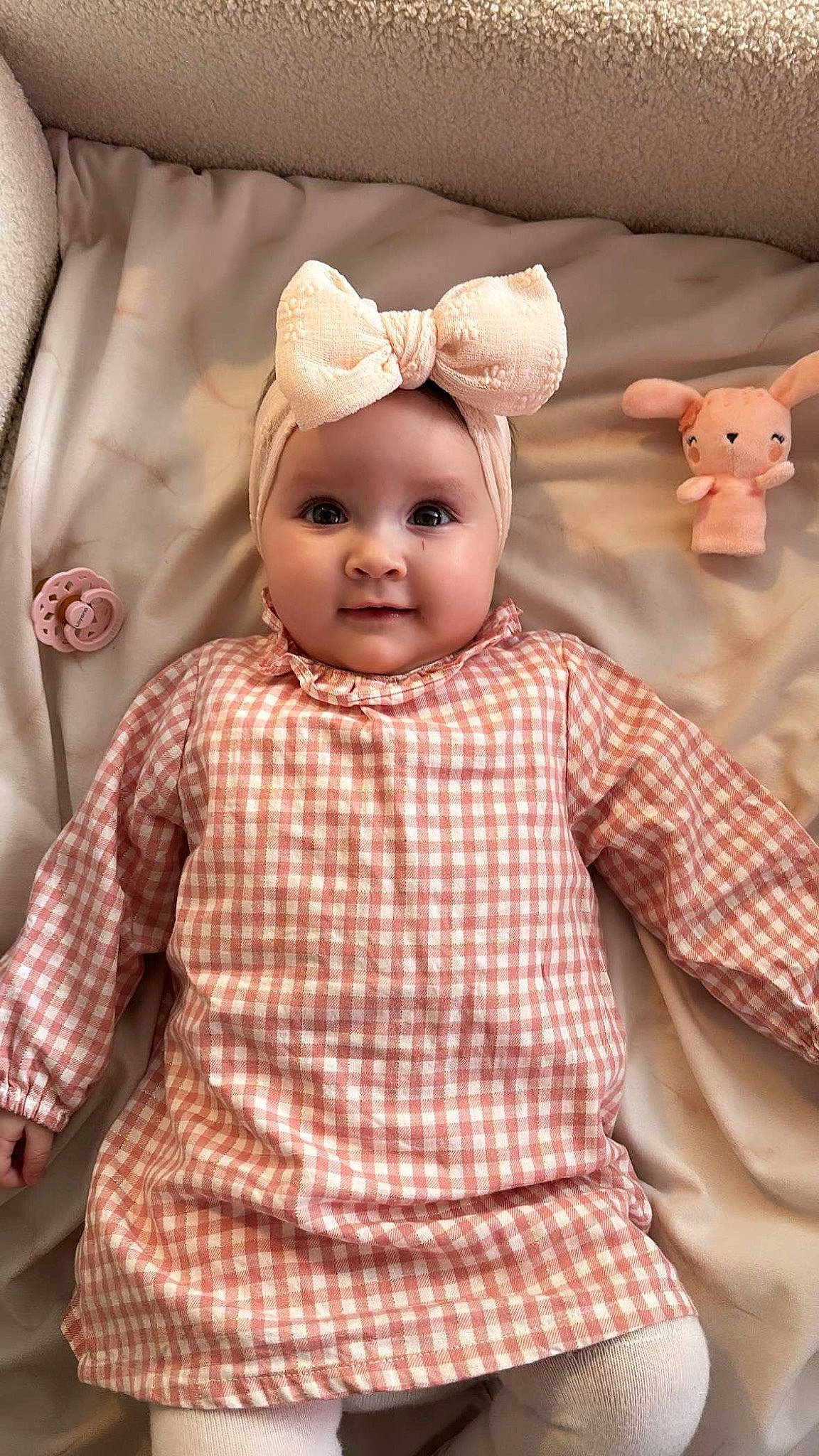 Layana participe au concours pour gagner de l'argent avec cette photo : baby, baby_toddler_clothing, cheek, child, design, doll, eyelash, happy, headwear, linens, pattern, peach, person, pink, product, room, skin, sleeve, textile, toddler