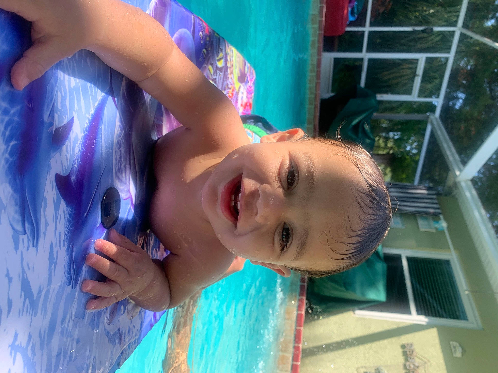 Kyngston is registered to the contest to win money with this photo: black_hair, child, electric_blue, eyelash, facial_expression, fun, happy, leisure, lip, magenta, mouth, nose, person, play, skin, smile, t_shirt, toddler, vacation, water