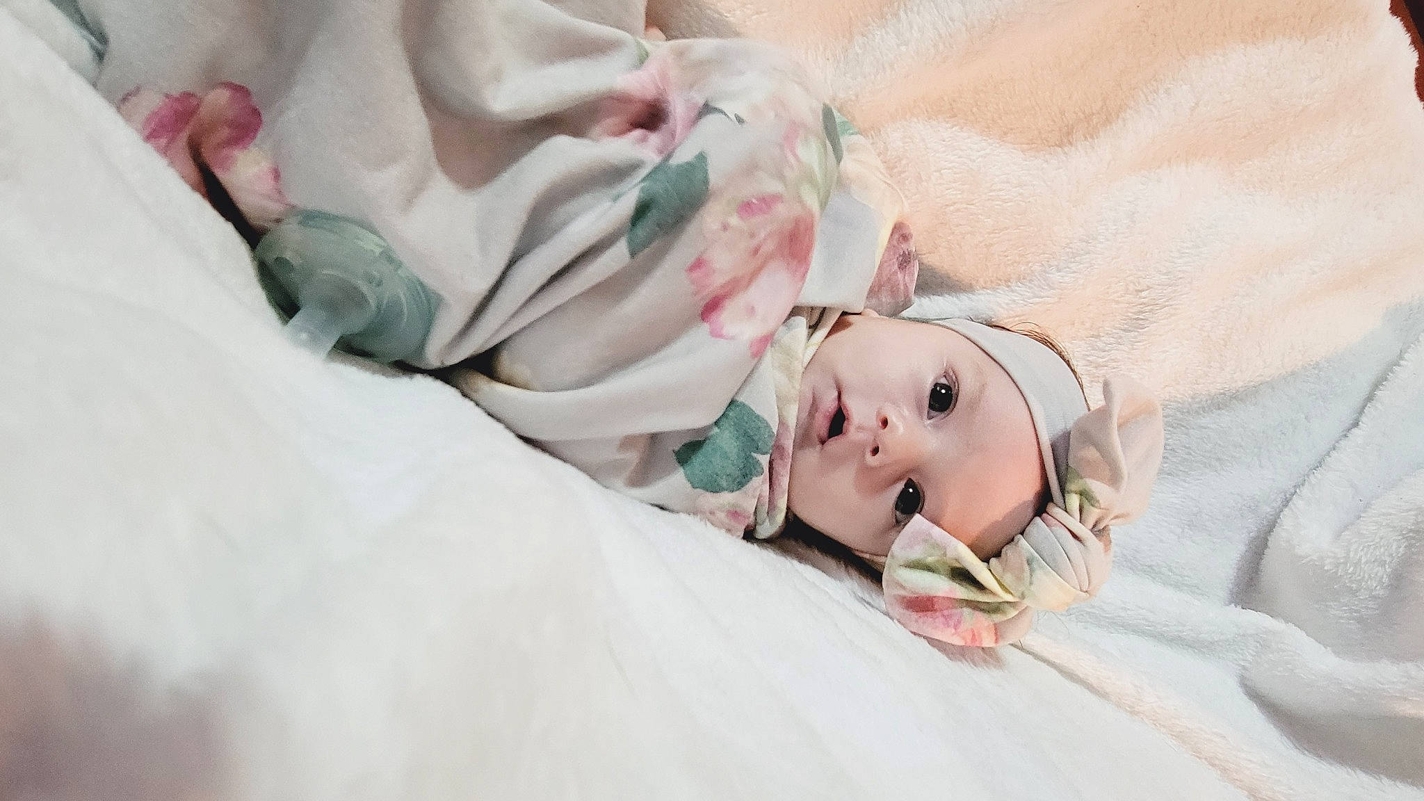 Ariah joined the competition — help win amazing prizes! baby, baby_toddler_clothing, bed_sheet, bedding, bedtime, child, comfort, dress, embellishment, event, eye, eyelash, fashion_accessory, fur, hat, headwear, linens, peach, person, petal