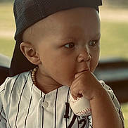 Anthony Jr. joined the competition — help win amazing prizes! baby, baseball, cap, casual_clothing, child, cute, daylight, expression, face, hand, hat, jersey, outdoor, portrait, soft_focus, sports, striped_clothing, thumb_sucking, toddler, young_child