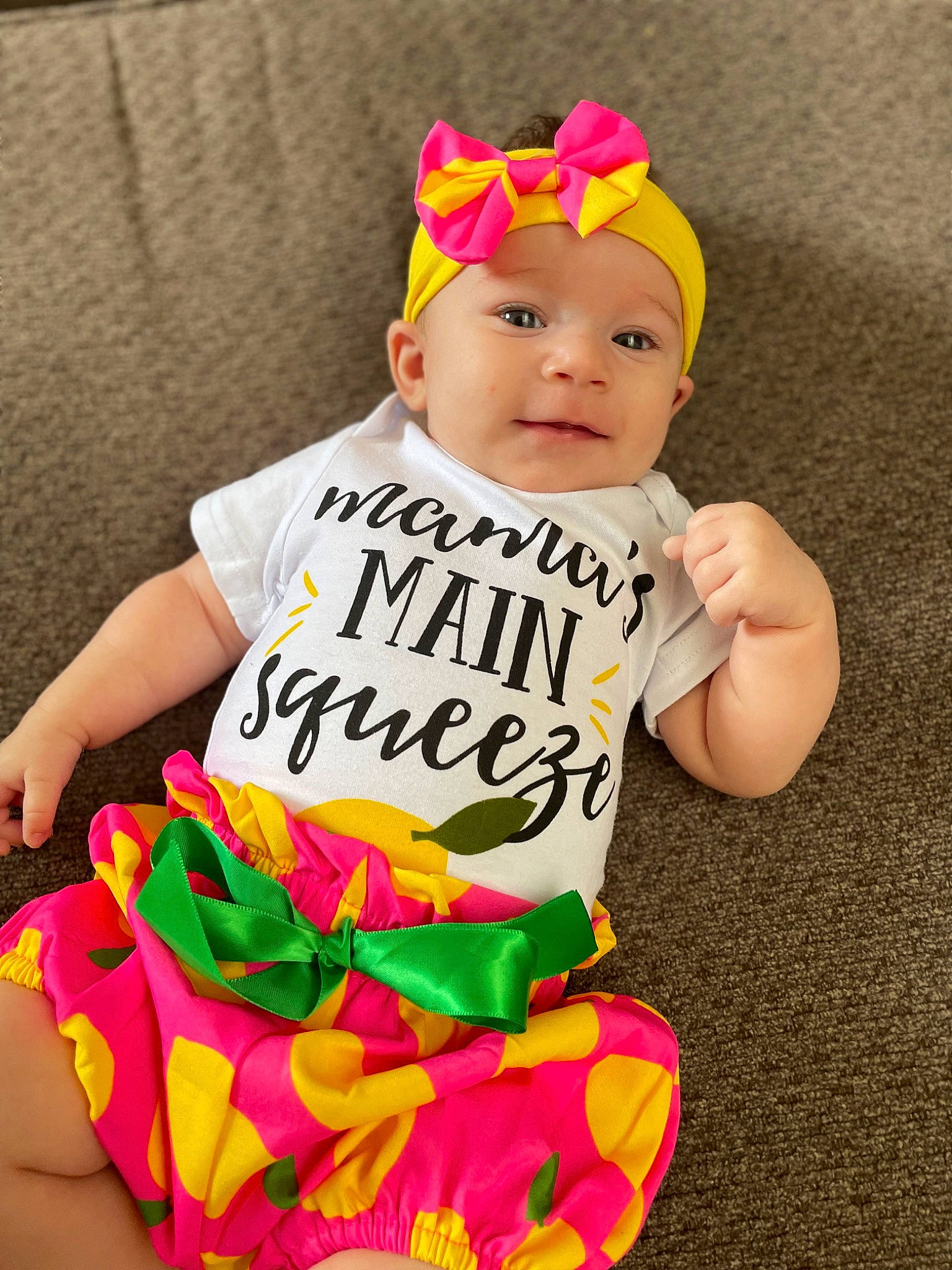 Avaeyah is registered to the contest to win money with this photo: baby, baby_products, baby_toddler_clothing, cap, child, costume_hat, event, fashion_accessory, fun, happy, headband, headwear, magenta, pattern, person, pink, sitting, sleeve, smile, sportswear