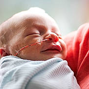 Malaki joined the competition — help win amazing prizes! baby, sleeping, newborn, blanket, medical_tube, face, infant, closeup, peaceful, child, person, soft_light, indoors, wrapped, skin, mouth, nose, head, tape, comfort