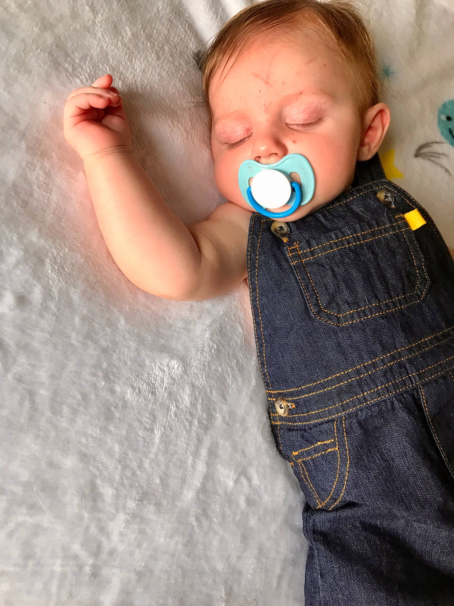Cayden is registered to the contest to win money with this photo: arm, baby, baby_toddler_clothing, cheek, child, comfort, eye, flash_photography, gesture, grey, happy, iris, linens, lip, neck, nose, pattern, person, skin, sleeve