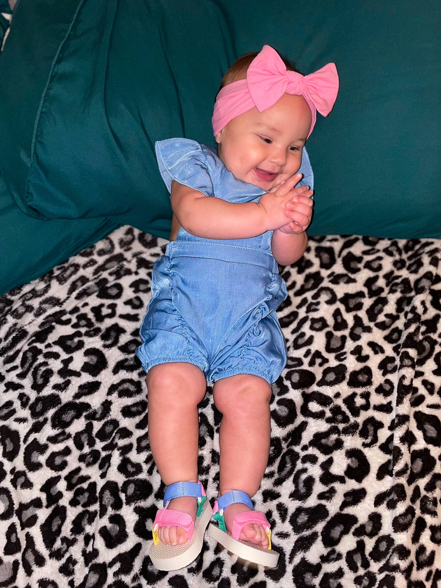 Zelena is registered to the contest to win money with this photo: azure, baby, baby_toddler_clothing, cap, child, comfort, couch, electric_blue, finger, happy, hat, headwear, human_leg, leg, pattern, person, pink, skin, smile, textile