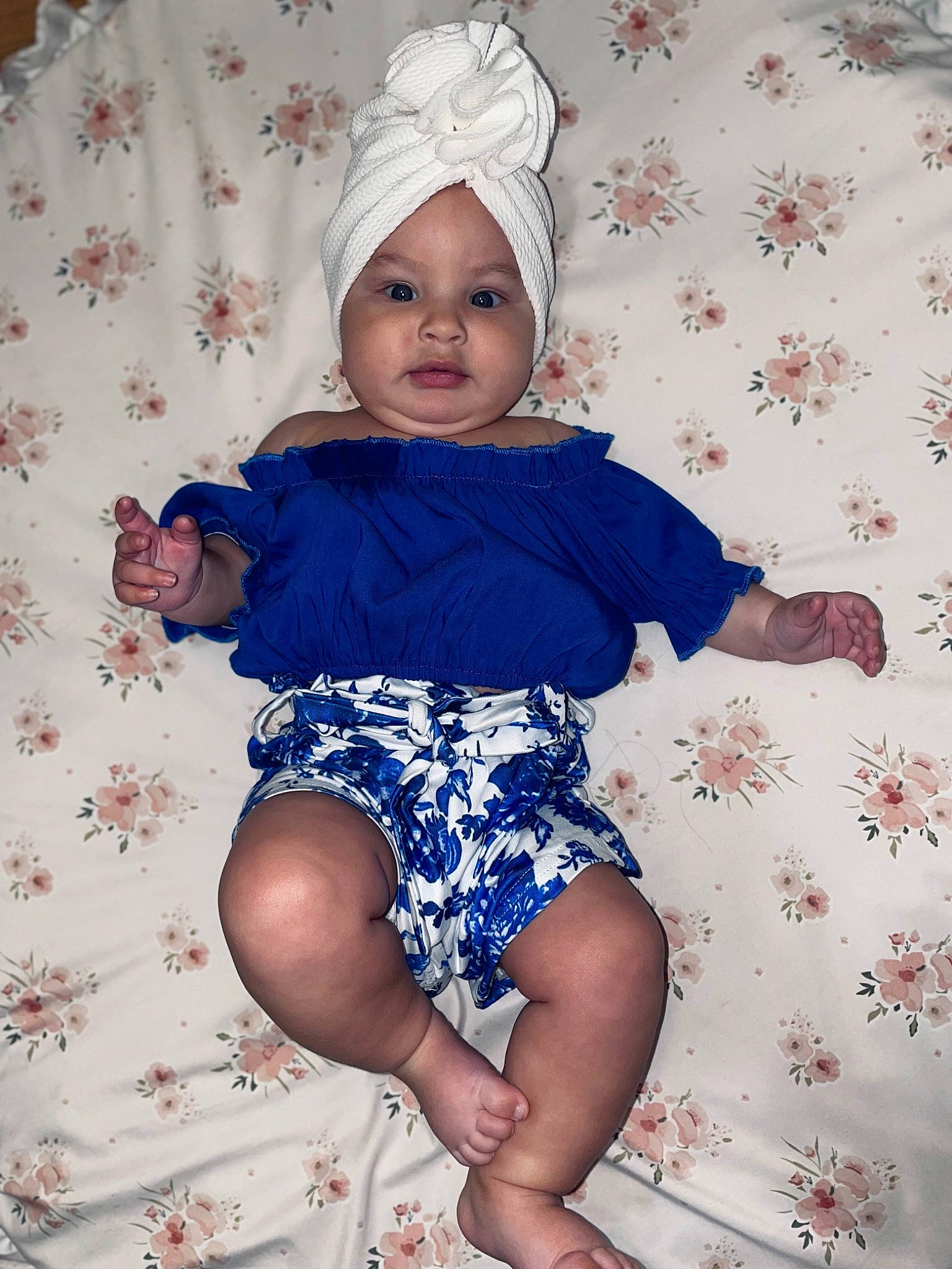 Zelena is registered to the contest to win money with this photo: arm, azure, baby_toddler_clothing, dress, eye, face, fashion_design, finger, head, headgear, headwear, leg, person, pink, purple, skin, sleeve, textile, thigh, toddler