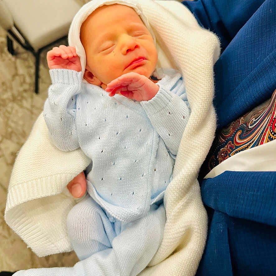 Liam joined the competition — help win amazing prizes! architecture, baby, bed, blanket, building, clothing, couch, cushion, face, furniture, glove, hat, head, homedecor, hospital, newborn, person, photography, portrait, sleeping