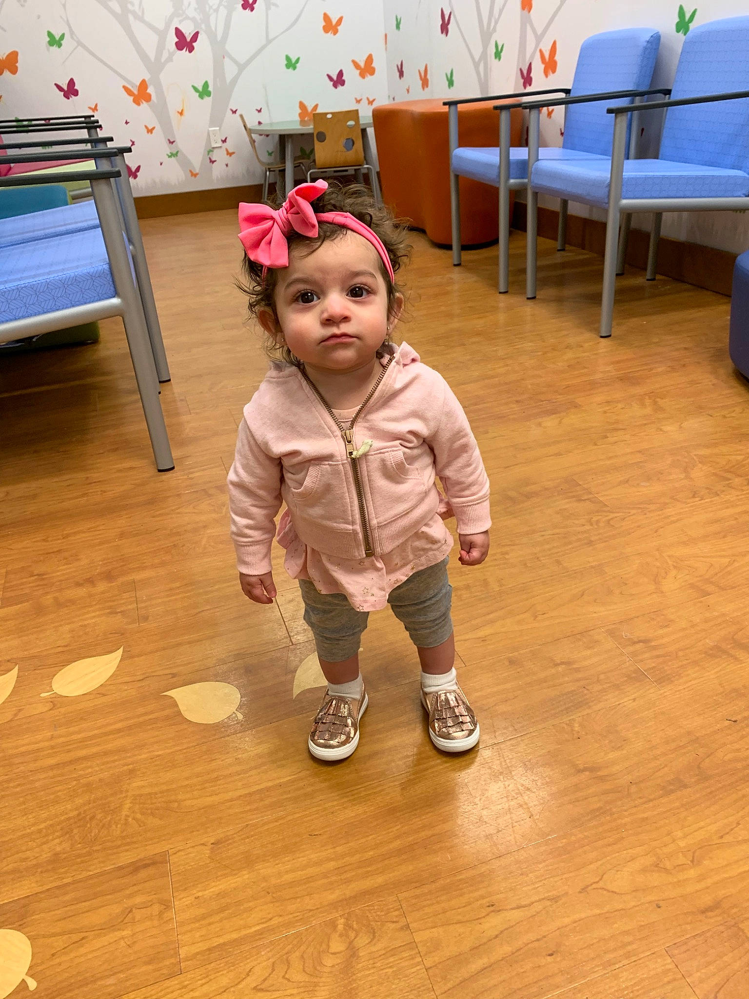 Ocean is registered to the contest to win money with this photo: child, floor, flooring, fun, hardwood, outerwear, person, play, toddler, wood, wood_flooring