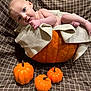 baby, pumpkin, blanket, infant, orange, decorative, cute, child, fall, autumn, cozy, knit, fabric, pattern, small_pumpkins, wrapped, portrait, indoor, smiling, face
