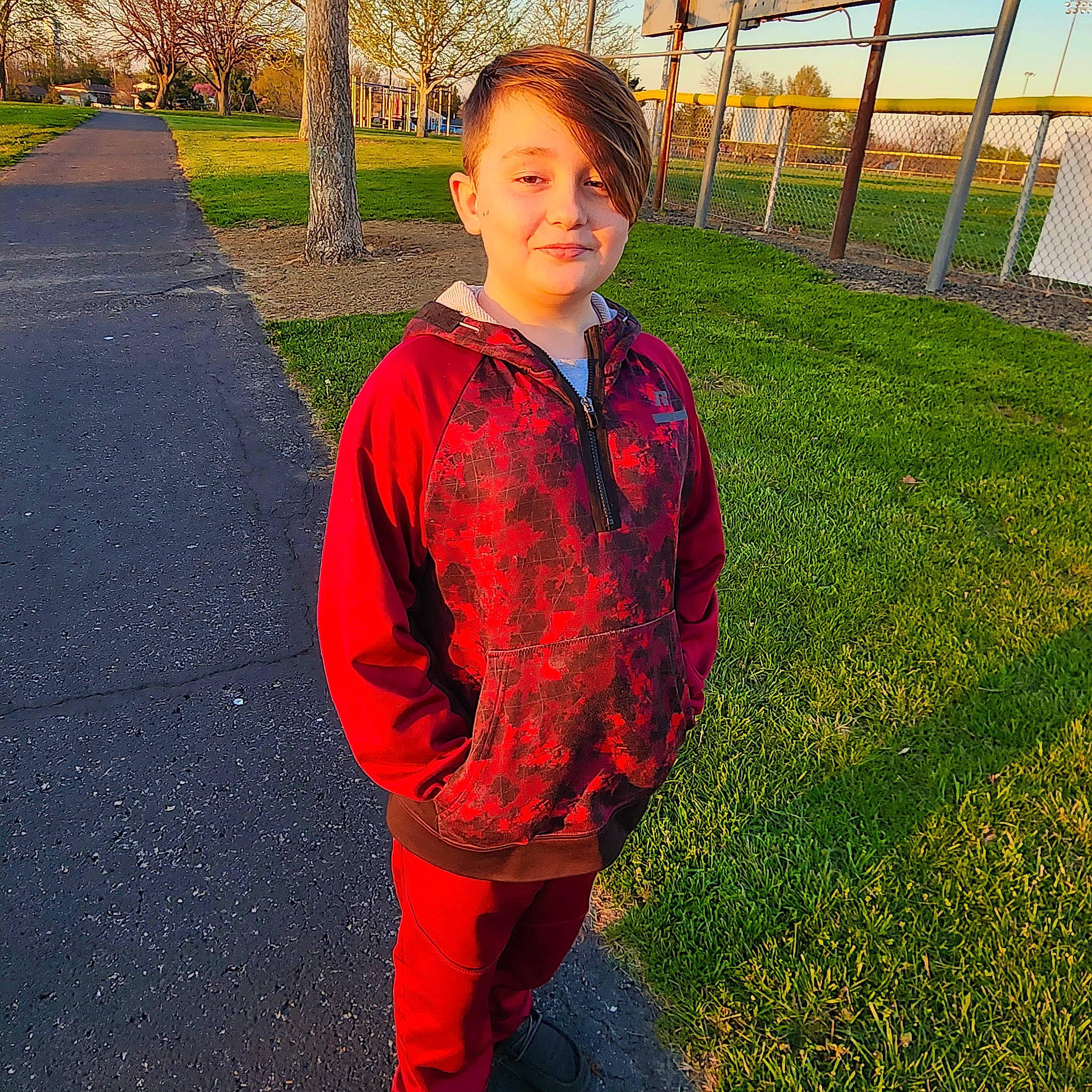 Aiden joined the competition — help win amazing prizes! asphalt, electric_blue, face, fence, fun, grass, happy, joy, lawn, leaf, leisure, pattern, people_in_nature, person, plant, sleeve, smile, sportswear, standing, t_shirt