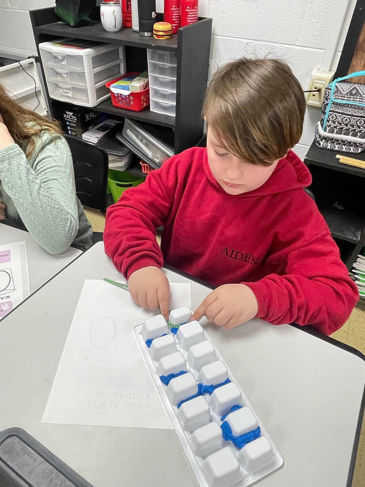 Aiden is registered to the contest to win money with this photo: automotive_design, chair, child, computer_keyboard, design, desk, electronic_device, engineering, input_device, job, learning, office_equipment, office_instrument, person, plastic, recreation, room, science, service, t_shirt