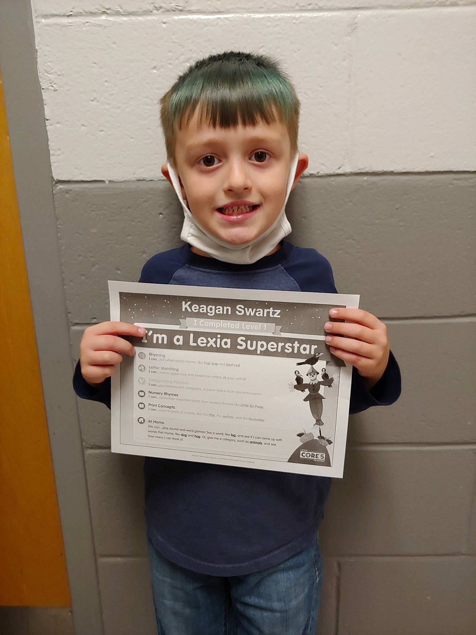 Keagen is registered to the contest to win money with this photo: child, clothing, denim, electric_blue, event, font, fun, handwriting, happy, job, joy, person, room, sleeve, smile, standing, t_shirt, writing