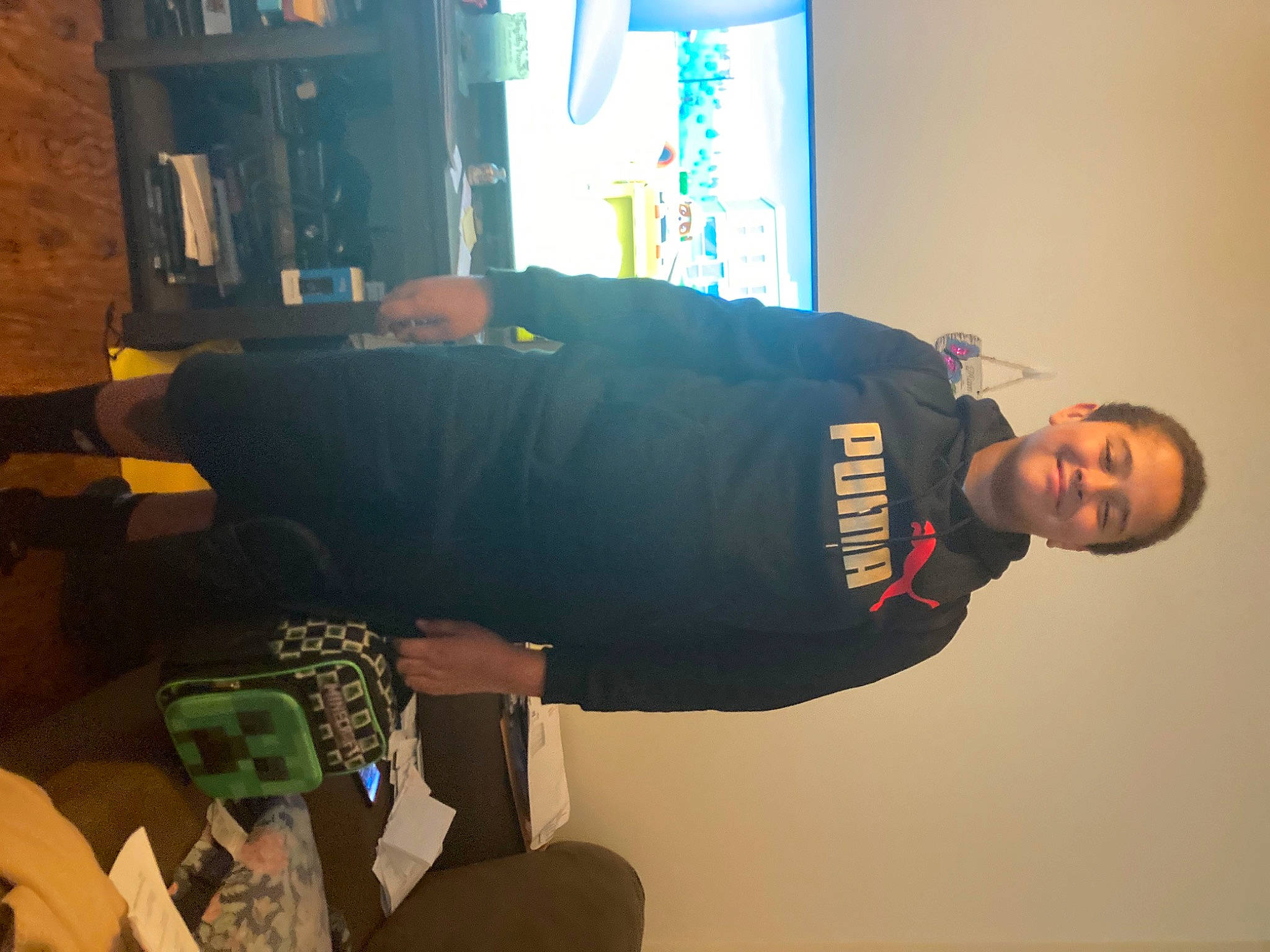 Jonathan is registered to the contest to win money with this photo: comfort, elbow, fun, hat, joy, knee, machine, person, personal_protective_equipment, room, sleeve, sportswear, t_shirt, top, wrist