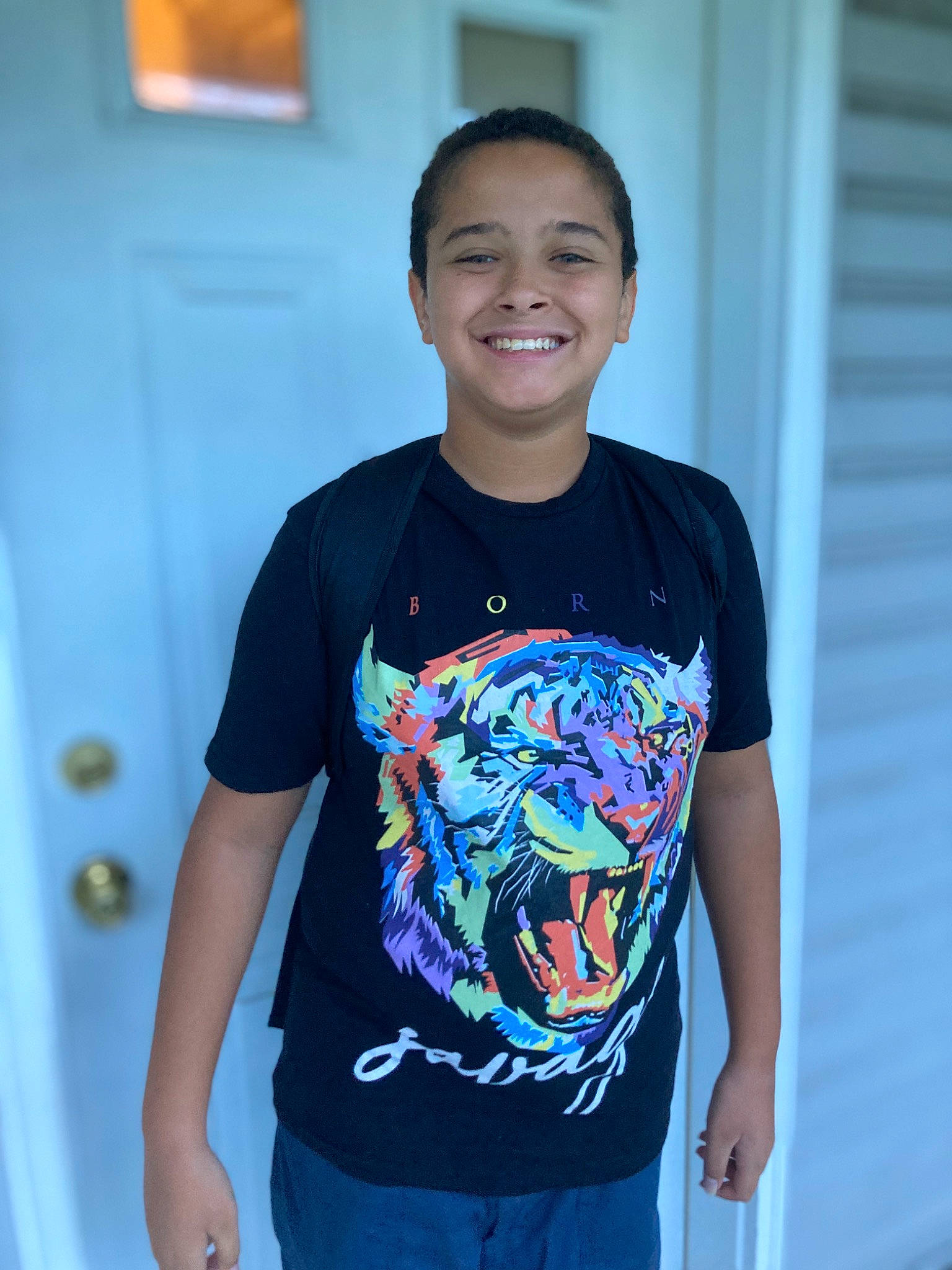 Jonathan is registered to the contest to win money with this photo: active_shirt, arm, chest, chin, cool, denim, electric_blue, fashion_design, hair, happy, human_body, joint, joy, magenta, neck, pattern, person, shoulder, sleeve, smile