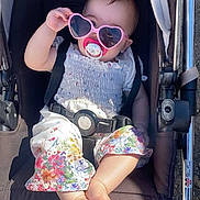 Tamara joined the competition — help win amazing prizes! baby, stroller, sunglasses, heart_shaped, pacifier, child, outdoor, sunlight, summer, clothing, floral, foot, hand, seatbelt, black, white, pink, cute, relaxed, portrait