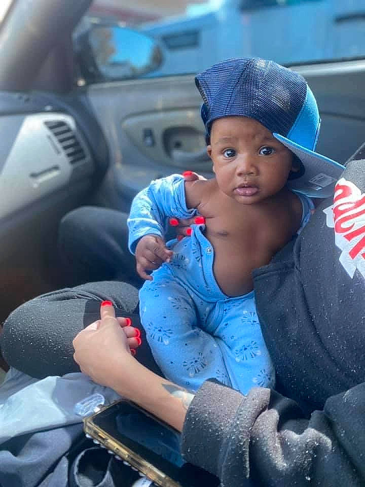 Robert is registered to the contest to win money with this photo: auto_part, automotive_design, automotive_exterior, automotive_wheel_system, baseball_cap, blue, cap, car, car_seat, car_seat_cover, electric_blue, family_car, headwear, luxury_vehicle, mid_size_car, motor_vehicle, person, personal_luxury_car, steering_wheel, toddler