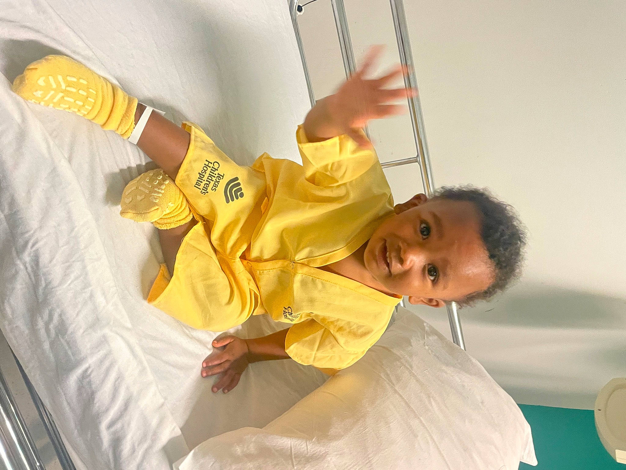 Robert is registered to the contest to win money with this photo: ceiling, child, comfort, elbow, event, fun, gesture, happy, leisure, person, room, smile, toddler