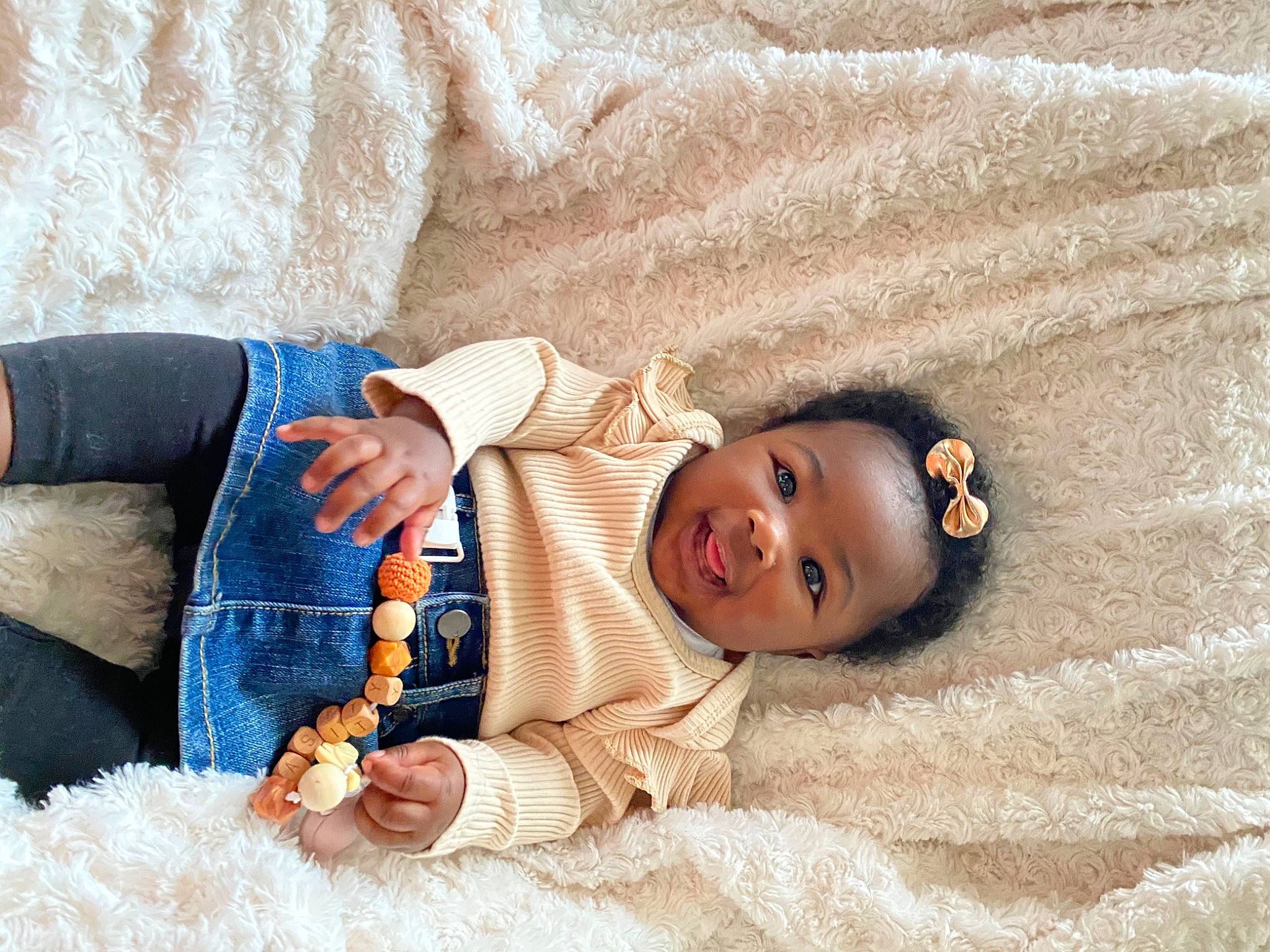 Chasity joined the competition — help win amazing prizes! baby, baby_sleeping, baby_toddler_clothing, comfort, couch, eye, fur, happy, head, human_body, iris, linens, nose, orange, person, skin, sleeve, smile, textile, toddler