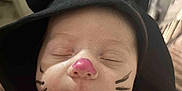 Myka joined the competition — help win amazing prizes! baby, face_paint, hoodie, black_clothing, cat_ears, sleeping, infant, closeup, cute, peaceful, child, portrait, costume, indoors, person, whiskers, pink_nose, soft_light, headwear, tiny