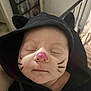 Myka joined the competition — help win amazing prizes! baby, face_paint, hoodie, black_clothing, cat_ears, sleeping, infant, closeup, cute, peaceful, child, portrait, costume, indoors, person, whiskers, pink_nose, soft_light, headwear, tiny