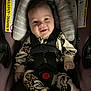 baby, smiling, car_seat, child, infant, seatbelt, clothing, cute, sitting, safety, happiness, indoors, padded, young_child, portrait, comfort, baby_outfit, happy, secure, closeup