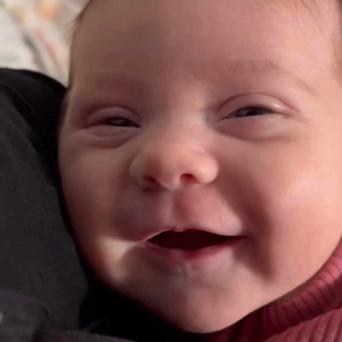 Myka is registered to the contest to win money with this photo: baby, child, close_up, clothing, cozy, cute, expression, eyes, face, happy, head, infant, joyful, mouth, person, portrait, skin, smile, warm, young