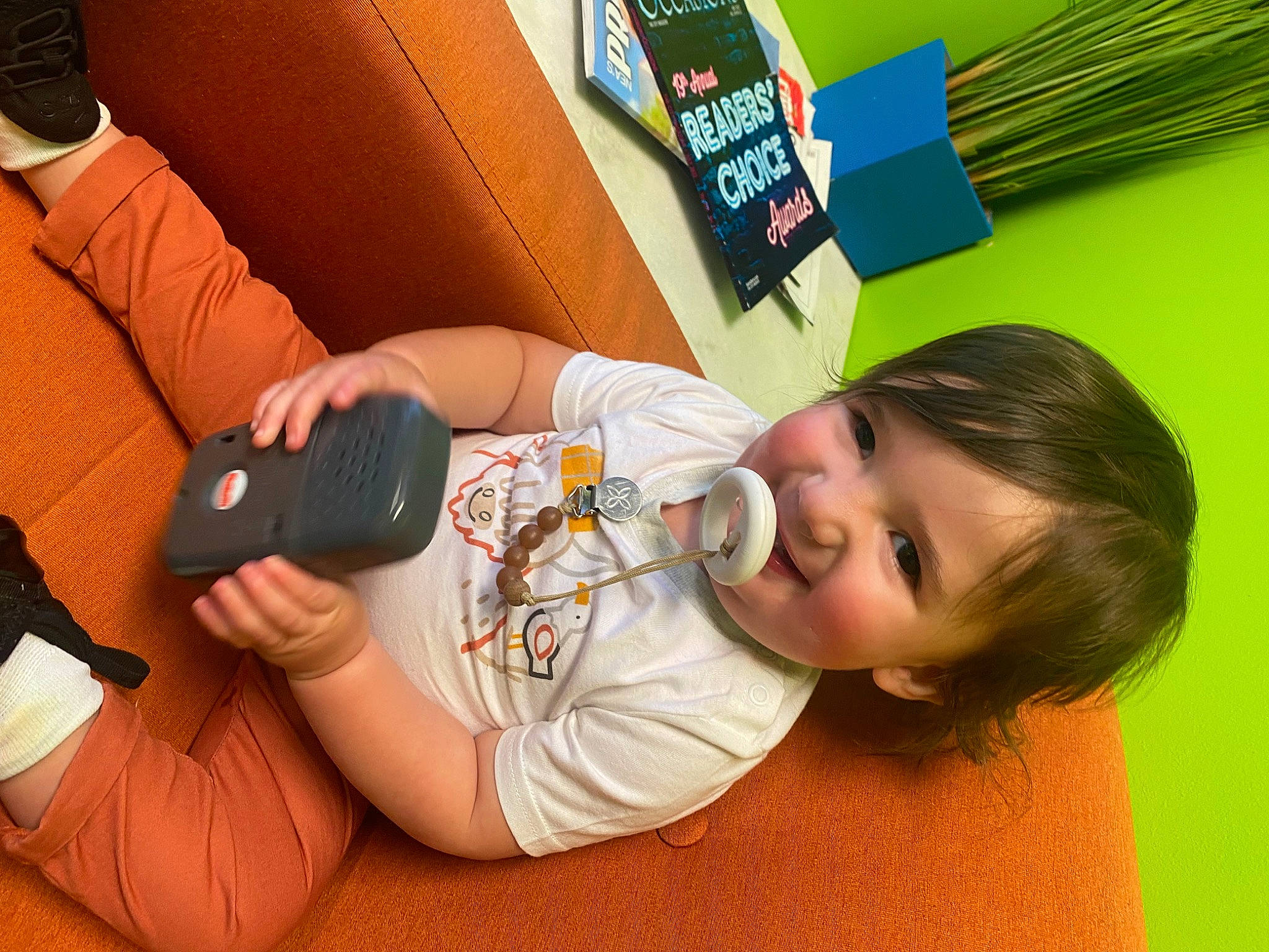 Holden joined the competition — help win amazing prizes! audio_equipment, child, comfort, elbow, finger, fun, gadget, happy, human_leg, joy, leisure, mobile_phone, nail, orange, person, play, room, skin, smile, thumb