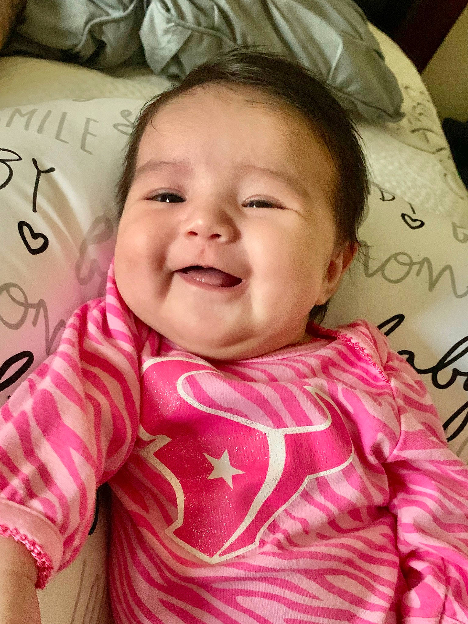 Celeste is registered to the contest to win money with this photo: baby, cheek, child, face, facial_expression, happy, head, joy, laugh, lip, mouth, nose, person, pink, skin, smile, toddler