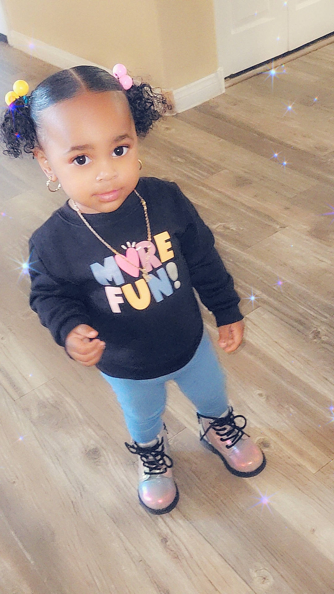 Khari is registered to the contest to win money with this photo: accessories, child, clothing, face, female, footwear, girl, hardwood, head, jewelry, necklace, pants, person, photography, portrait, sandal, shoe, sitting, sneaker, wood