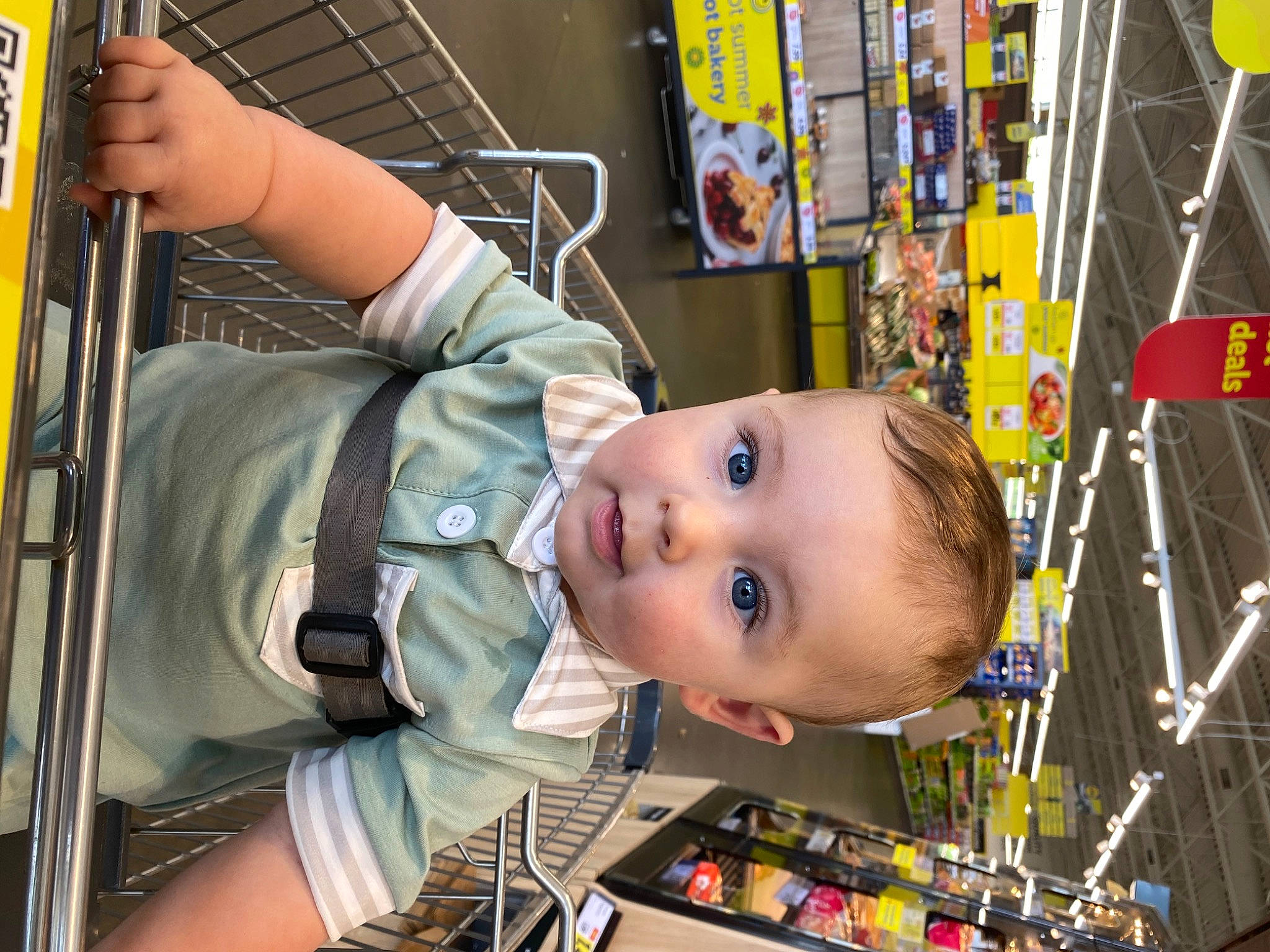 Boone is registered to the contest to win money with this photo: amusement_ride, baby, baby_products, child, fun, leisure, person, play, recreation, retail, room, service, shelf, snapshot, supermarket, t_shirt, toddler, toy, transport, vacation