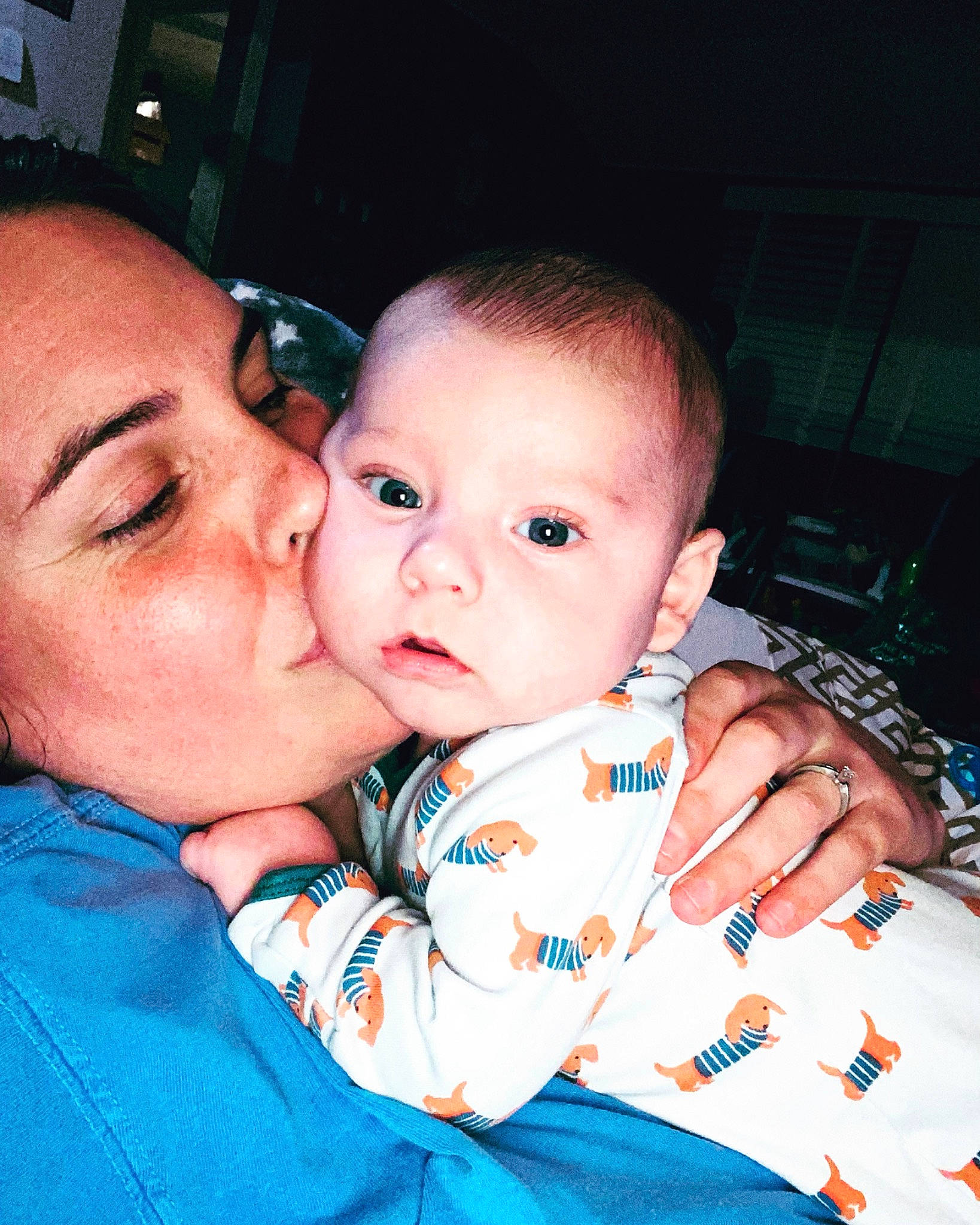 Boone is registered to the contest to win money with this photo: baby, baby_toddler_clothing, cheek, chin, cool, ear, eyebrow, eyelash, face, facial_expression, finger, gesture, hairstyle, happy, iris, kiss, lip, mouth, nose, person