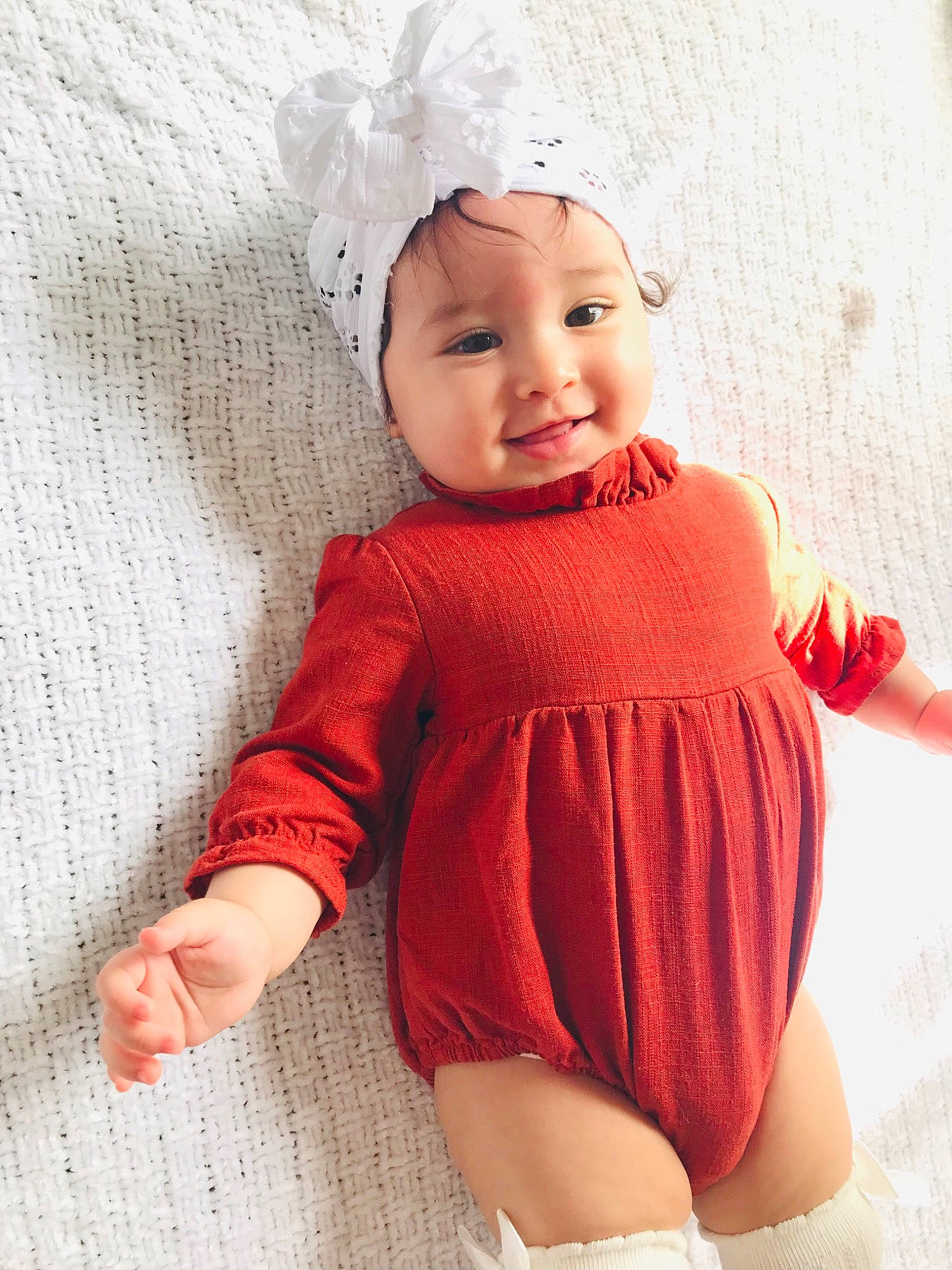 Isabella joined the competition — help win amazing prizes! baby, baby_toddler_clothing, cap, eye, face, happy, headwear, leg, lip, neck, outerwear, pattern, person, pink, skin, sleeve, smile, standing, textile, thigh