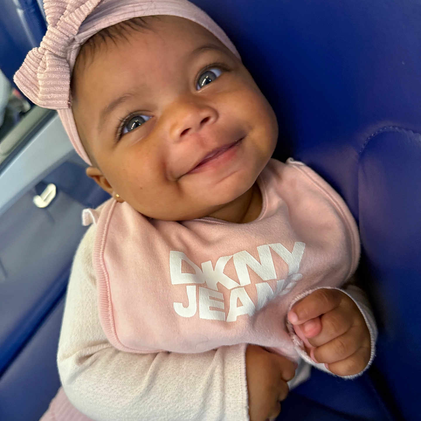Taishaly joined the competition — help win amazing prizes! apparel, baby, bib, blue, bow, child, clothing, cute, eyes, face, hands, happy, headband, infant, person, pink, portrait, seat, sitting, smile