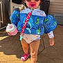 toddler, child, sunglasses, pacifier, floatation_vest, bottle, pink, shoes, outdoor, sunny, concrete_floor, swimsuit, clip, sea_creatures, dolphin, seahorse, life_jacket, person, standing, summer